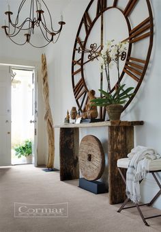 a living room with a large clock on the wall