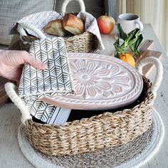 "[About This Handmade Bread Warmer] Looking for a unique and handmade gift for a baker or home entertainer? Check out this bread and tortilla warmer set from Gift Shop BY KORISSA! The set includes a ceramic stone for warming bread and tortillas, and a wicker woven basket. This set makes for a great hostess gift, new home gift, housewarming gift, wedding gift, newlywed gift, anniversary gift, mom birthday gift, or gift for her or him. Perfect for anyone who loves to bake or entertain at home! 🎁 For Add-On Personalized Wooden Gift Tag Options for Gift Box, Click the link below.  https://www.etsy.com/listing/1550716620/personalized-wooden-gift-tag-add-on-gift Our terracotta plate has been engraved with a flower design and cut to fit neatly into a wicker basket. This special bread warmer is n Terracotta Plate, Bread Warmer, Screen Print Tea Towels, Handmade Bread, Oval Basket, Seagrass Basket, Printed Tea Towel, Basket Gift, Cloth Napkin