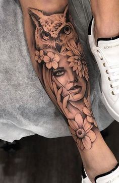 a woman's leg with an owl and flowers tattoo on her left calf sleeve