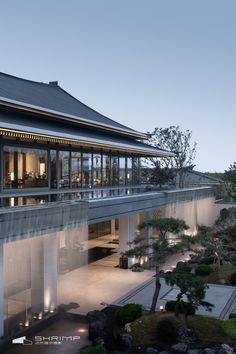 an exterior view of a building at dusk