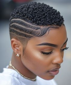 This very short style focuses on styling the baby hairs around the hairline to create intricate patterns. It adds a feminine touch to an otherwise edgy, short cut. Baby Hair Styling, Tapered Natural Hair Cut, Natural Hair Haircuts, Ladies Hairstyles, Short Haircuts For Black Women, Black Hair Short Cuts, Shaved Hair Cuts, Haircuts For Black Women, Tapered Natural Hair