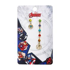 the avengers earrings are on display in front of a card