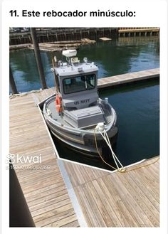 a small boat docked at a dock in the water