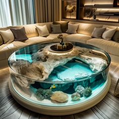 a living room filled with furniture and a large fish tank in the middle of it