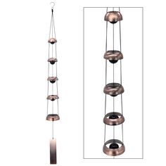 an image of a wind chime hanging from the ceiling with four bells attached to it