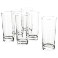 a set of six glasses sitting next to each other