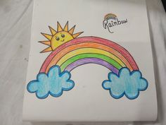 a drawing of a rainbow with clouds and a sun on the top in white paper