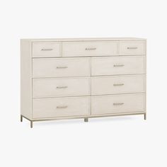 a large white dresser with six drawers