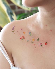 a woman's chest with flowers on it