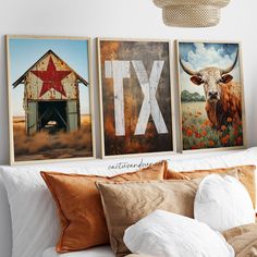 three framed pictures hang on the wall above a bed in a room with white sheets and pillows