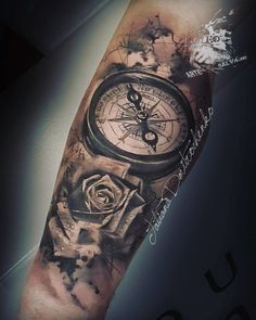 an arm with a clock and rose tattoo on it's left arm, in black and grey ink