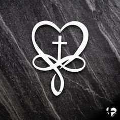 a heart with a cross in the middle on a black marble background that says, i love jesus