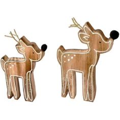 two wooden deers are standing next to each other