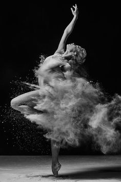 a ballerina is dancing in the dust