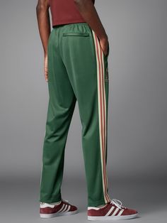 adidas Men's Soccer Mexico Beckenbauer Track Pants - Green | Free Shipping with adiClub | adidas US Casual Adidas Sweatpants For Training, Casual Adidas Training Bottoms, Casual Training Pants With Three Stripes, Casual Training Joggers With Three Stripes, Casual Joggers With Three Stripes Branding For Training, Casual Training Bottoms With Side Stripes, Green Casual Bottoms For Sports Events, Casual Green Bottoms For Sports Events, Casual Training Pants With Side Stripes