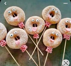 there are donuts with sticks sticking out of them that look like faces and mouths