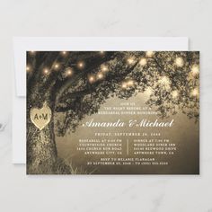 an elegant wedding card with string lights hanging from the tree and heart on it's back