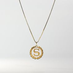 Level the way you wear a gold letter pendant. Stand out from the crowd and wear a solid gold letter pendant that outshines the typical lettering pendant. This 14K gold letter pendant redefines the way you wear a classic letter necklace. It presents the gold letter necklace in the most regal fashion, yet is still appropriate for wear on a day-to-day basis. Fall in love with how masterful this gold lettering pendant was created. It features intricate details that are nothing but stunning. The circ S Name Locket, Chain Lockets For Men, Dollar Gold Designs, S Locket Letter Gold, Chain Lockets Gold Simple, Letter S Necklace, Initial Necklace Gold Letters, Regal Fashion, Gold Letter Pendants