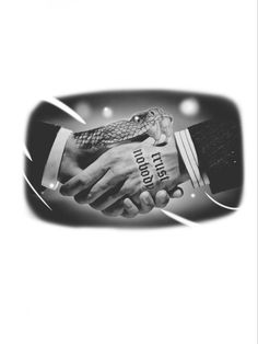 two people shaking hands with an alligator on the other hand in black and white photo