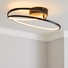 a circular light fixture in an empty room