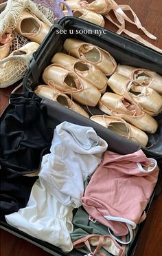 there are many pairs of shoes in the suitcase