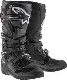 a pair of black and white motorcycle boots