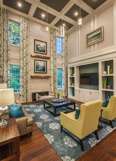 a living room filled with furniture and windows