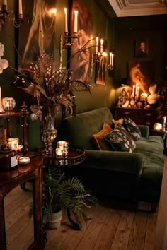 a living room filled with furniture and candles