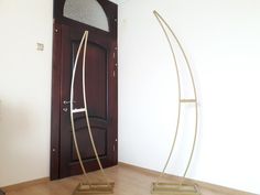 two metal sculptures sitting in front of a door