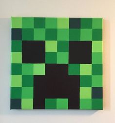 a green and black square shaped painting on a white wall, with the shape of a dog's head