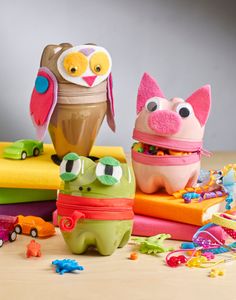 an assortment of toys sitting on top of a table next to each other and one owl