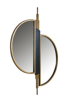 a mirror that is on the wall next to a pole with an object in it