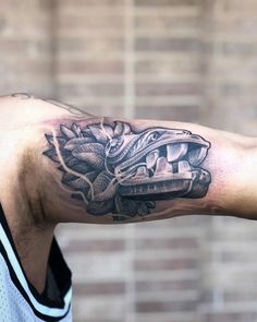 a man with a tattoo on his arm