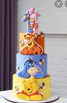 winnie the pooh birthday cake is decorated with fondant and edible decorations, including honey bears