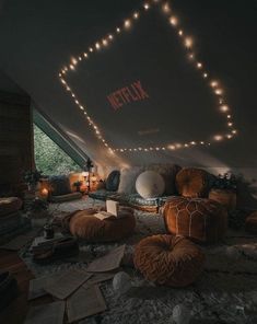 a room filled with lots of pillows and lights