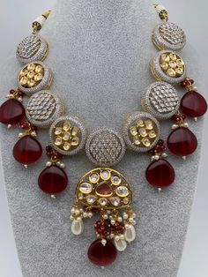 Kundan AD Red Beads Short Necklace with Matching EarringsColor : GoldenSize : Necklace Length : Approx 16 Inches; Earring Length : 3.75 InchesStones : Kundan AD Red Stone Red Beads Pearls Necklace Traditional, Red Beads, Red Bead, Red Stone, Short Necklace, Social Events, Necklace Length, Indian Jewelry, Necklace Lengths