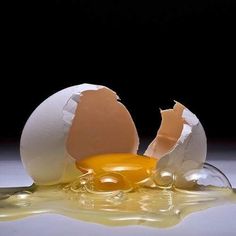 an egg is broken in half on the table