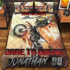 a bed with a motorcycle on it and the words dare to dream written in red