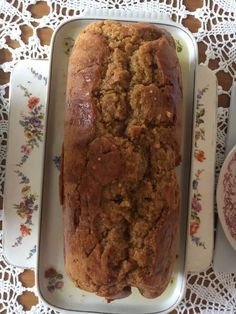 a loaf of bread sitting on top of a white plate