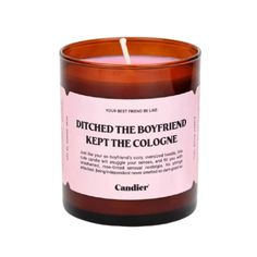 a candle that reads, ditch the boyfriend keep the cologne on it's side