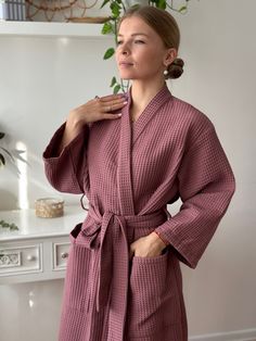 "Wrap yourself in luxurious comfort with our handcrafted Waffle Kimono Style Bathrobe. Experience the embrace of the softest waffle texture, ensuring a cozy, high-quality, and sustainable indulgence. Ideal for gifting on any occasion. This robe invites you to revel in the spa experience within your own home. Crafted from 100% pure organic Netherlandish cotton and certified by Oeko-Tex Standard 100, this robe guarantees premium quality and environmental consciousness. Revel in its absorbency, quick-drying nature, and breathability, while relishing its durable and hypoallergenic properties. Our commitment to comfort and sustainability extends to the 100% cotton waffle material, ensuring easy garment care for lasting enjoyment. Key Features: Unparalleled softness and comfort Quick absorption Home Robe Women, Waffle Robe Women, Pink Spring Robe For Relaxation, Pink Robe For Spring Relaxation, Pink Elegant Kimono For Loungewear, Elegant Pink Kimono For Loungewear, Feminine Long Sleeve Kimono For Loungewear, Pink Spring Kimono For Home, Pink Cotton Sleep Robe