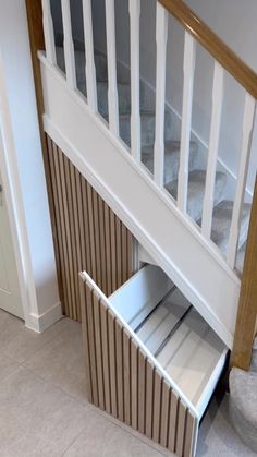 an under stair storage unit in a house