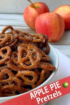 apple pie pretzels in a bowl with apples behind it