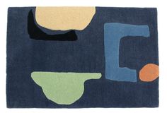 a blue rug with various shapes and colors