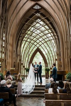 the bride and groom are getting married at the alter