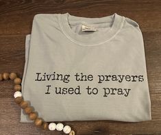 Living the Prayers I used to Pray ❤️ My new favorite tshirt!  Design can be put on any color shirt you would like! I can do comfort color tshirts or Gildan Sweatshirts. 😊 please just specify in the listing upon ordering which you are wanting!  High quality DTF design which means no cracking, peeling or falling off like vinyl. Pray Shirt, Faith Tshirts, Christian Tshirt, 15% Off Sale, Gildan Sweatshirts, Color Shirt, Comfort Color, Tshirt Design, Star Shirt