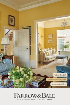 a living room with yellow walls and blue furniture in the center is featured by farrow & ball