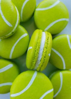 a pile of green and white tennis balls