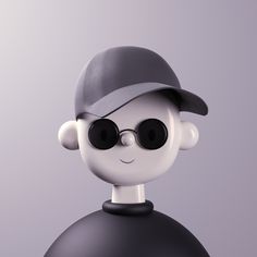 a little boy with sunglasses and a hat on top of a black ball in front of a gray background