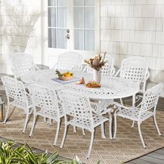 a white table and chairs on a patio